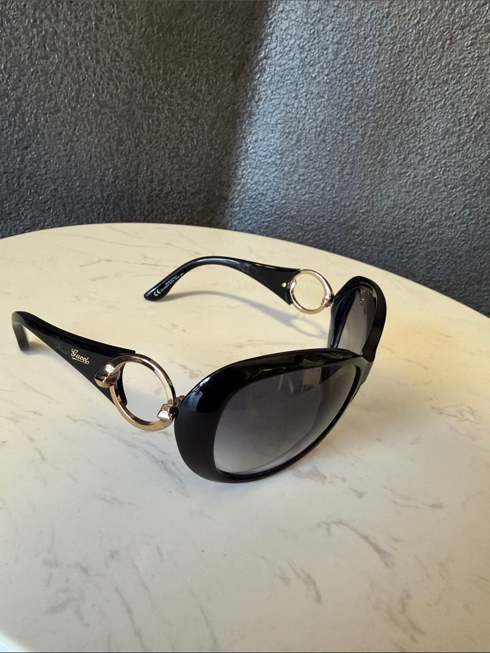 Gucci Sunglasses. Excellent condition . Black and Gold